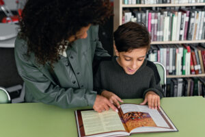 Boy beside a woman in a jacket